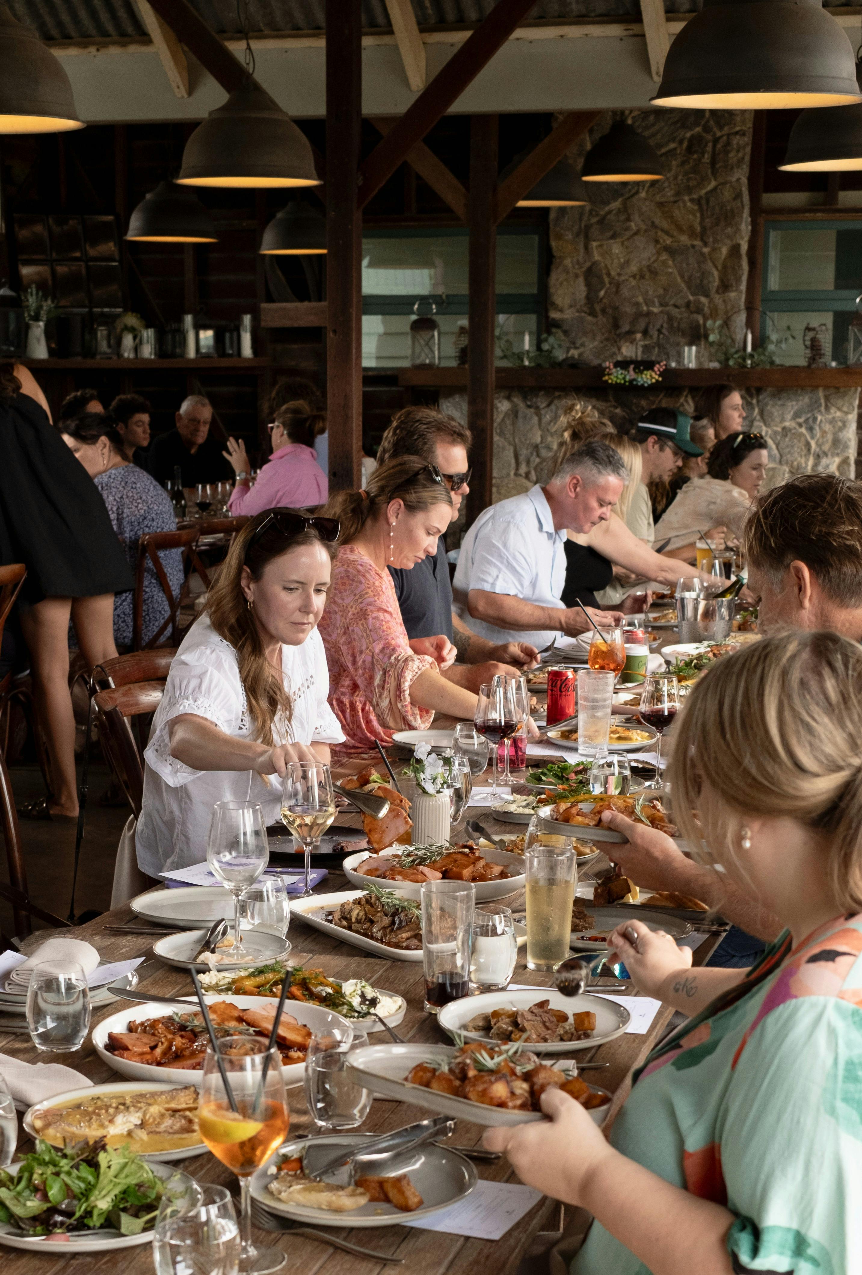 long table of people sharing food