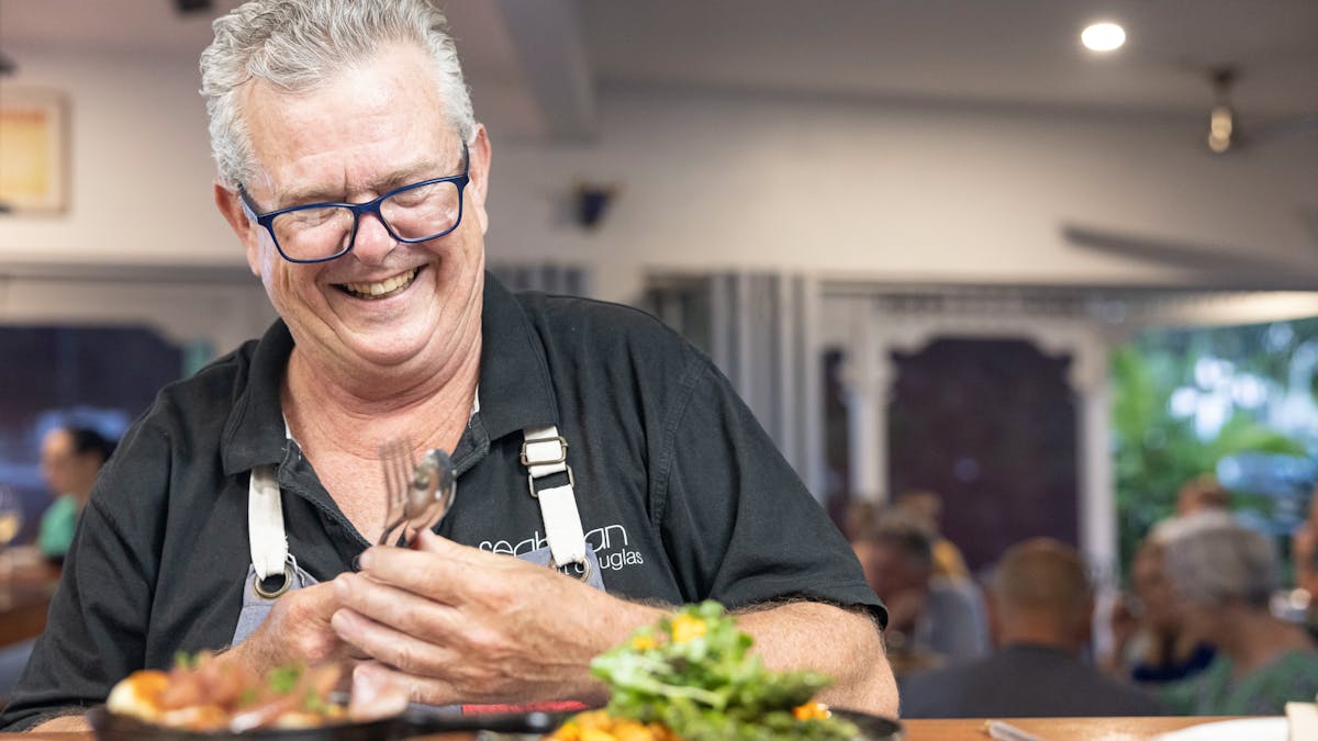 The Boss, Henry Johnston at the pass taking tapas to guests