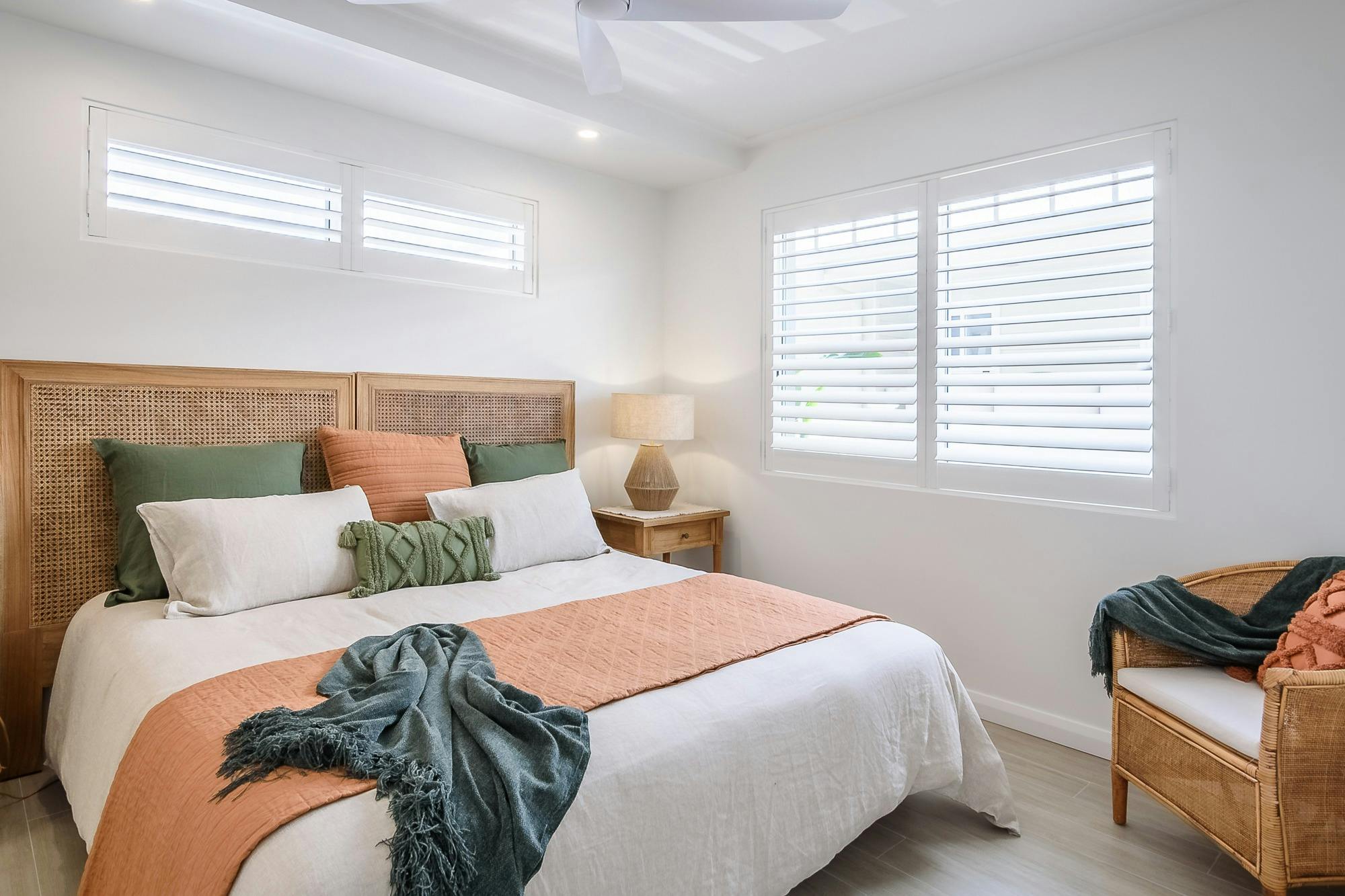 Main bedroom with bedside tables and comfy throw
