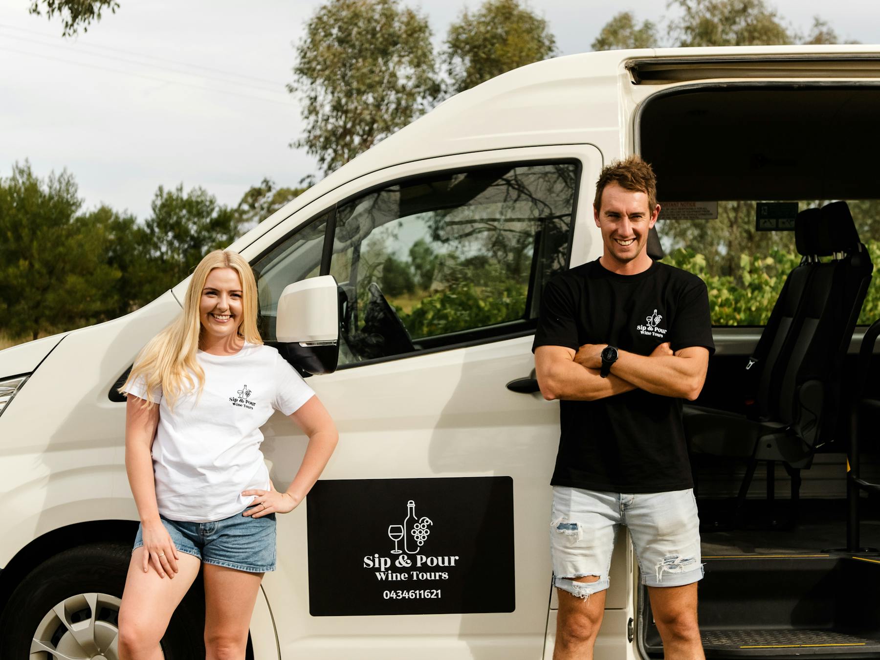 Couple leaning on bus