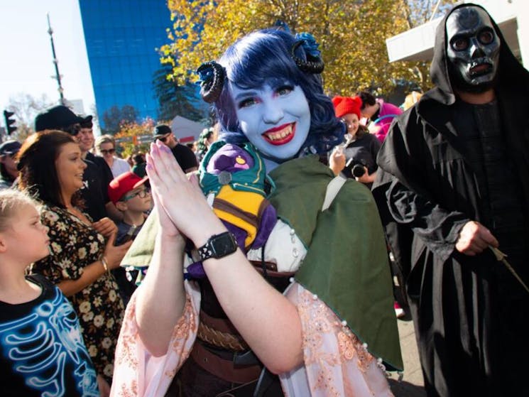A young woman dressed in cosplay costume and makeup