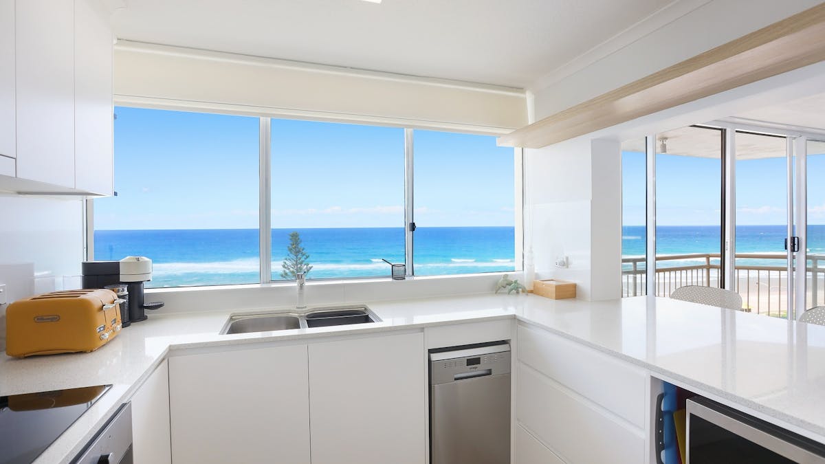 Fully eqipped kitchen with dishwasher, stove top, oven, fridge, etc. Seacrest 11A Apartments