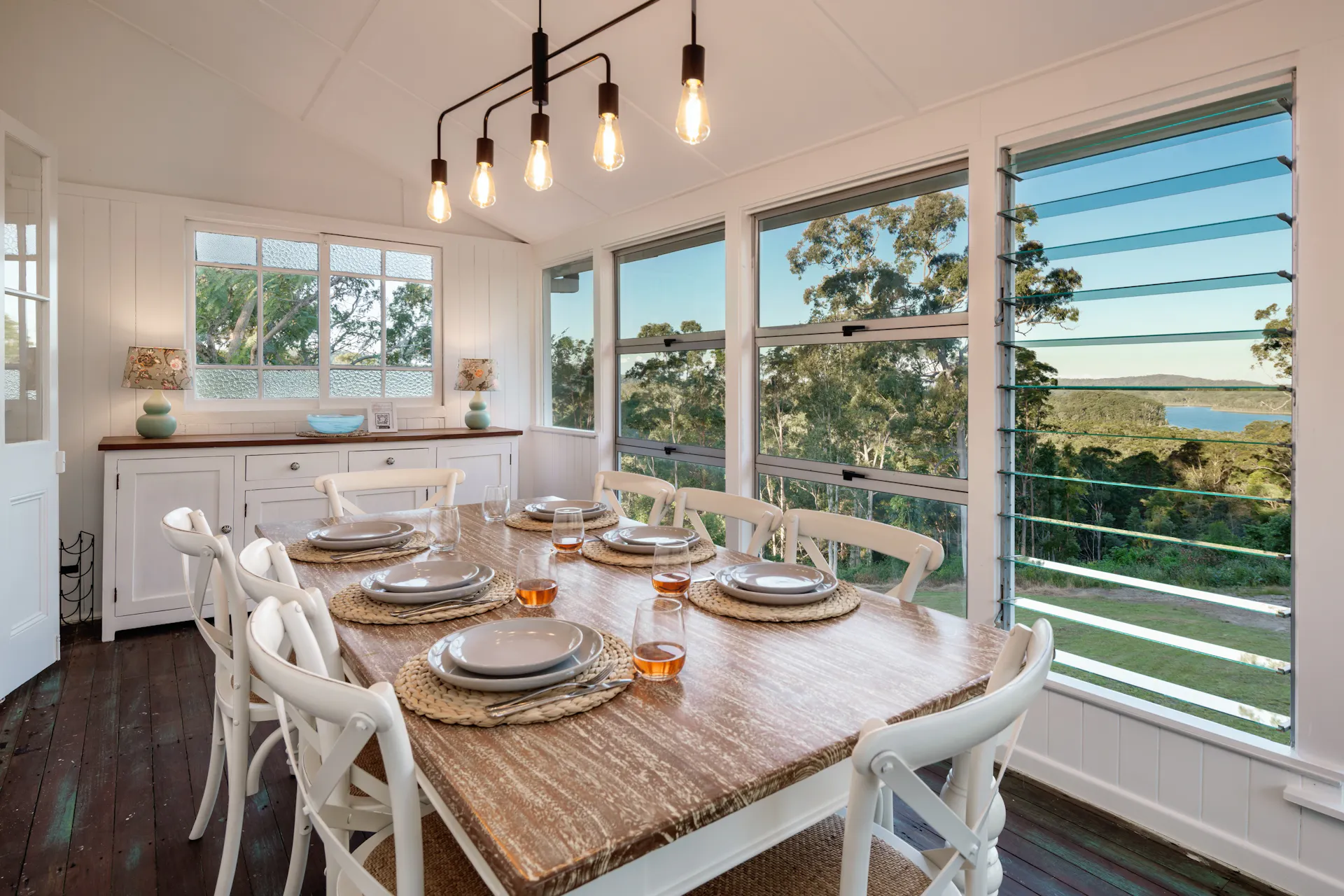 The charming dining room with stunning views of the Dam and bushlands.