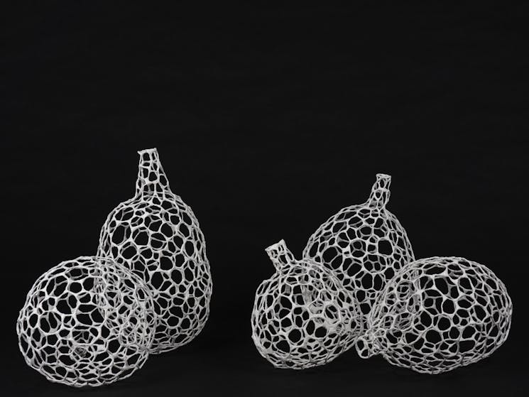 Five white woven objects