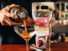 Martini Shaker pouring Bean Me Up Scotty into a Martini Glass