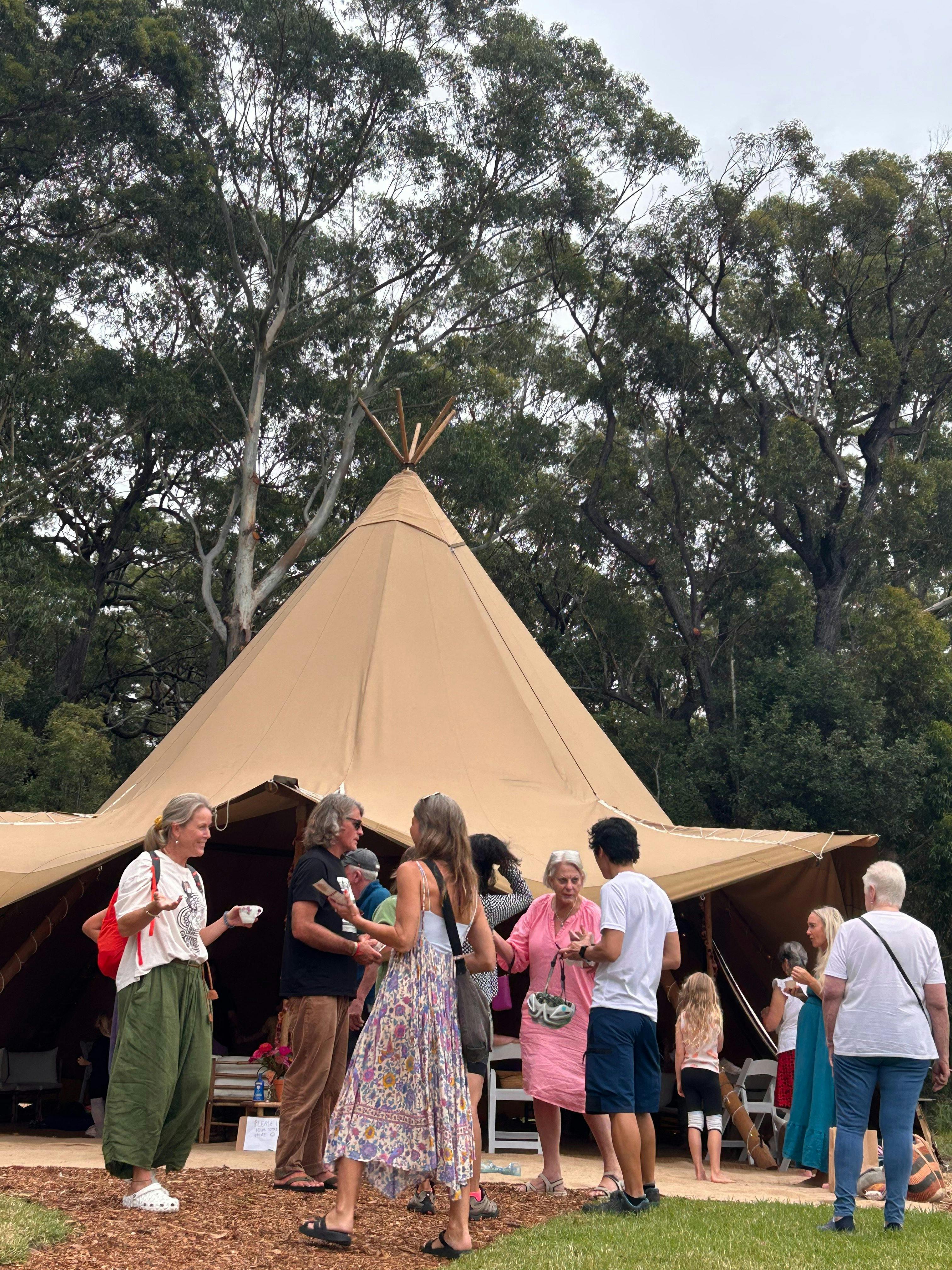 tipi and people chatting