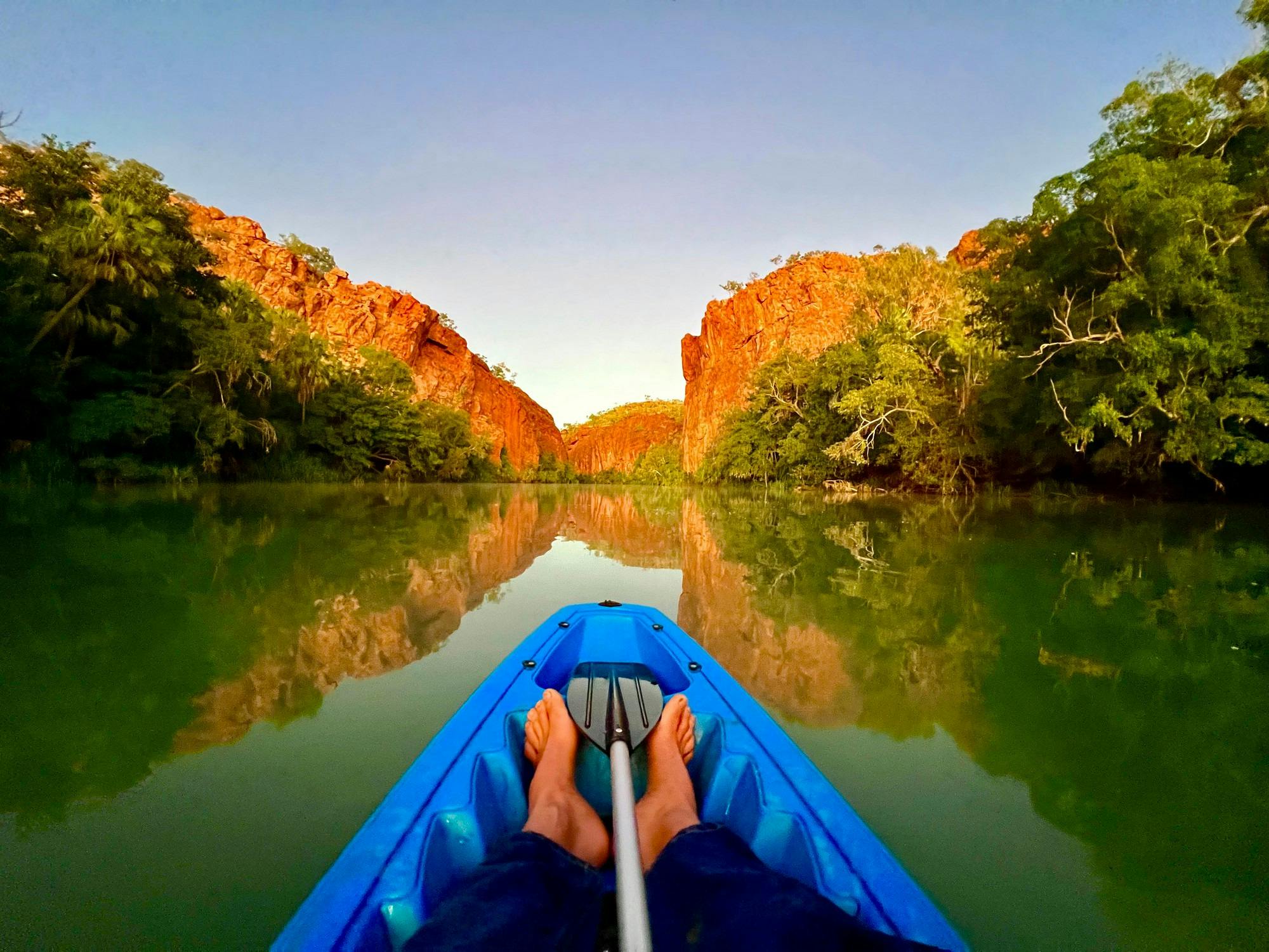 canoe in water in red gorge