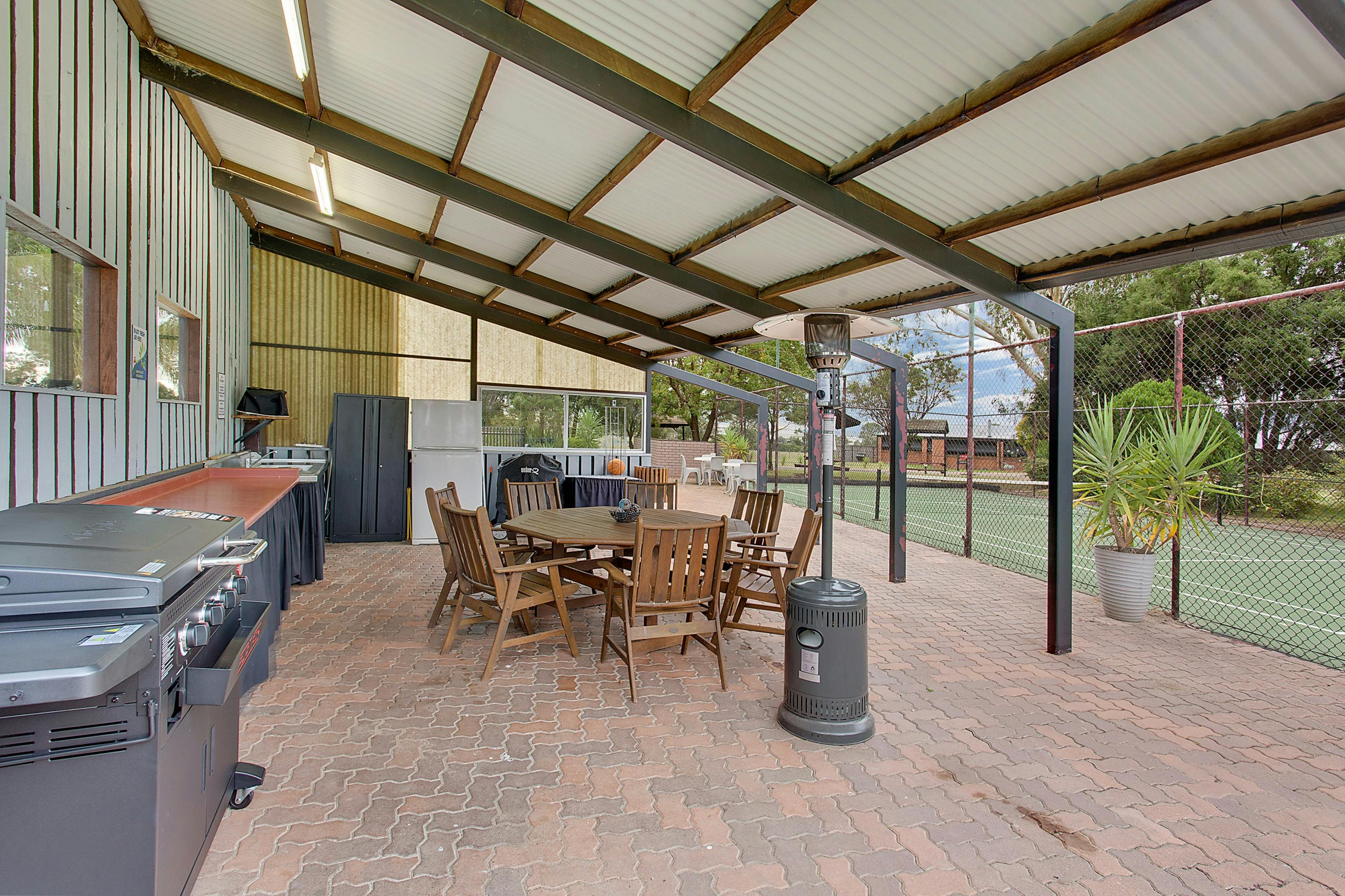 Amenities include Fridge, microwave, BBQ, Seating, TV & half size tennis court
