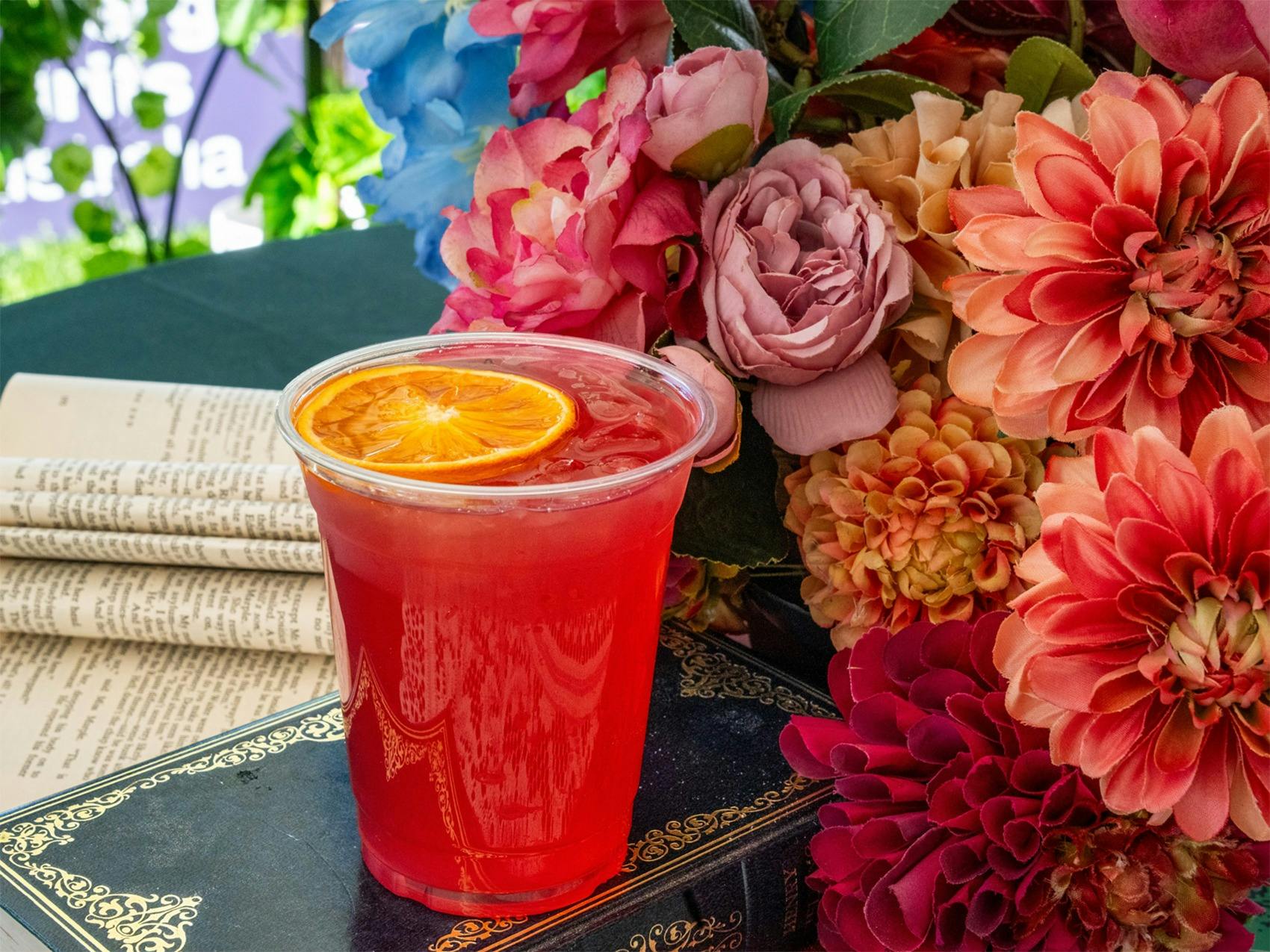 Colourful spring gin cocktail with orange garnish at the Underground Spirits Gin Garden, Floriade Ca