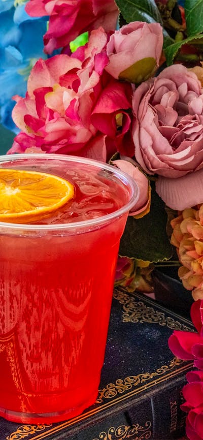 Colourful spring gin cocktail with orange garnish at the Underground Spirits Gin Garden, Floriade Ca