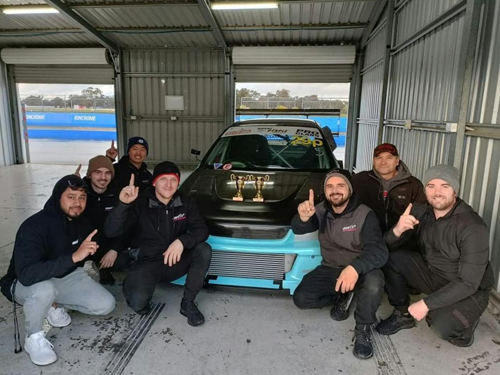 Group of car racing crew