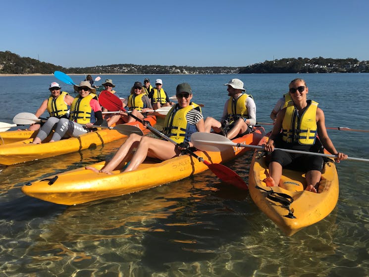 Group of people rafted up on a kayak tour in Sydney