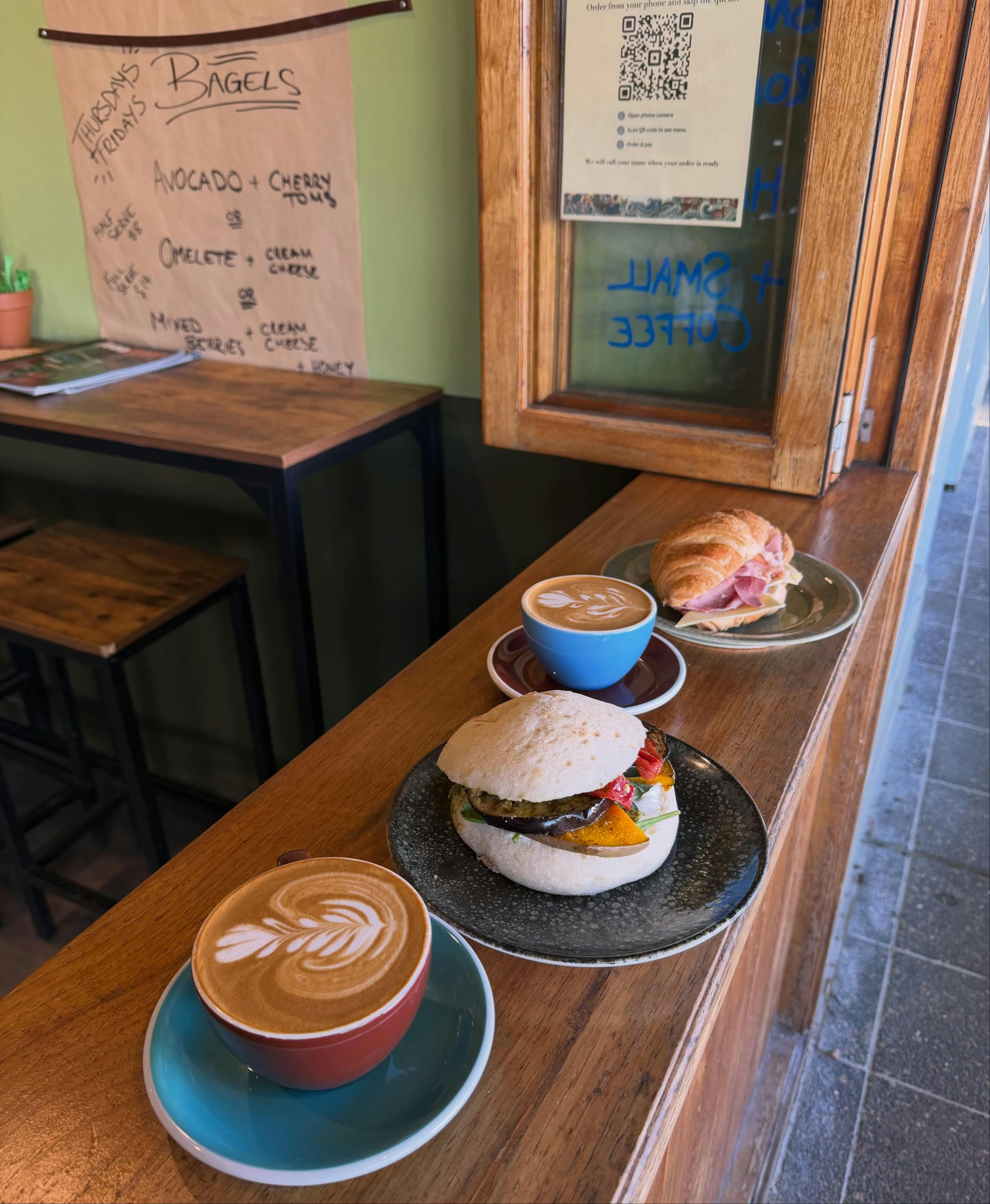 coffees and bagels on timber counter