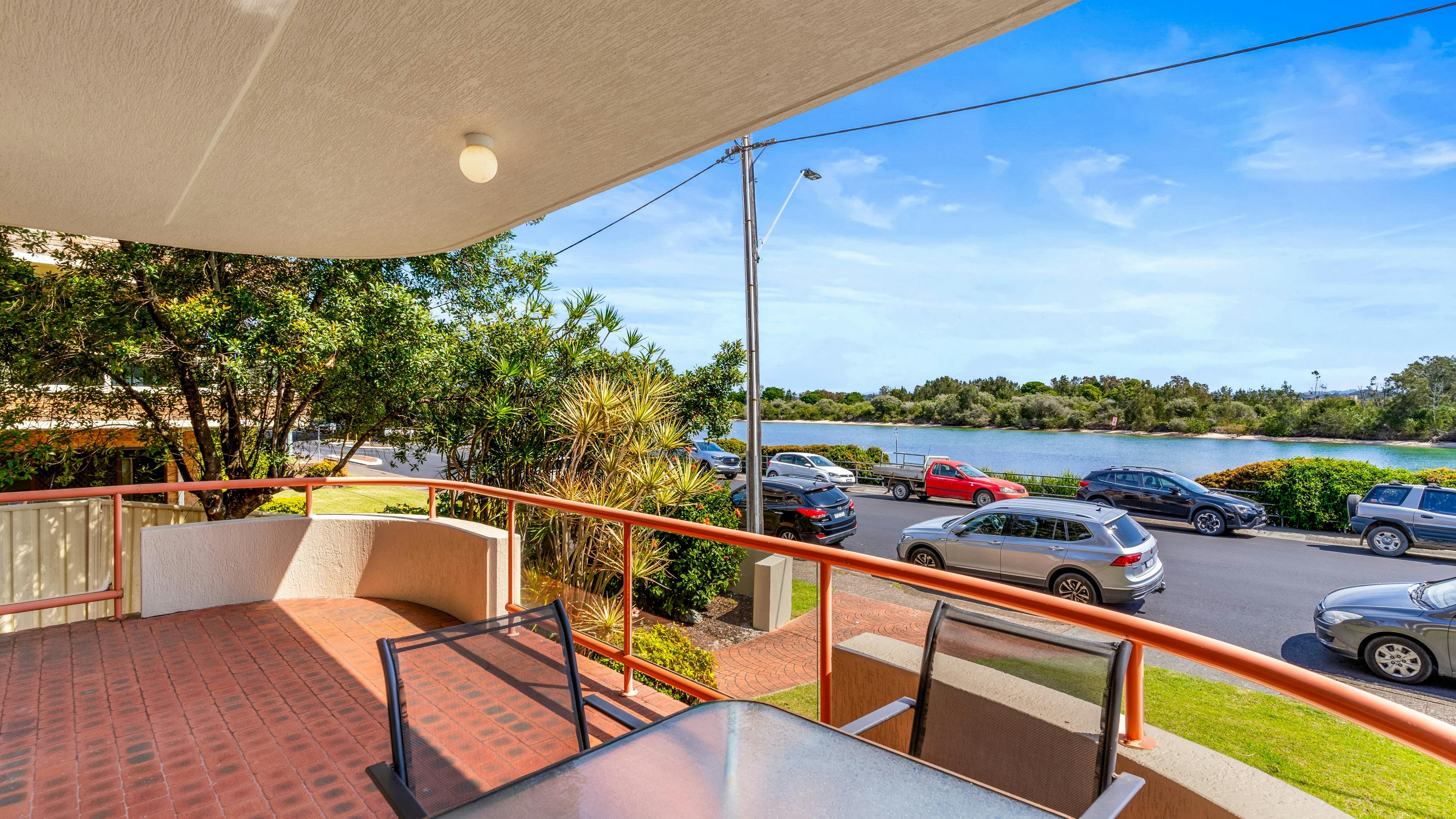 Balcony with dining setting and lake views