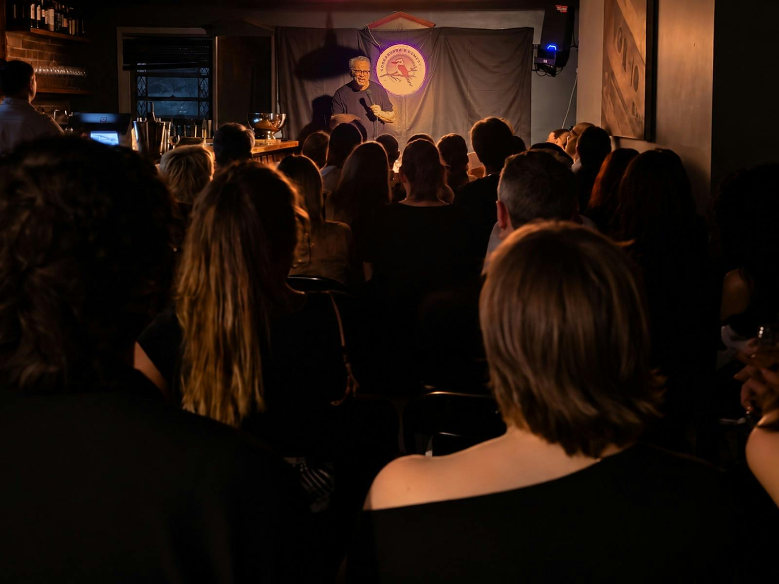 Audience enjoying a stand-up comedy show at The Drummer in Glebe