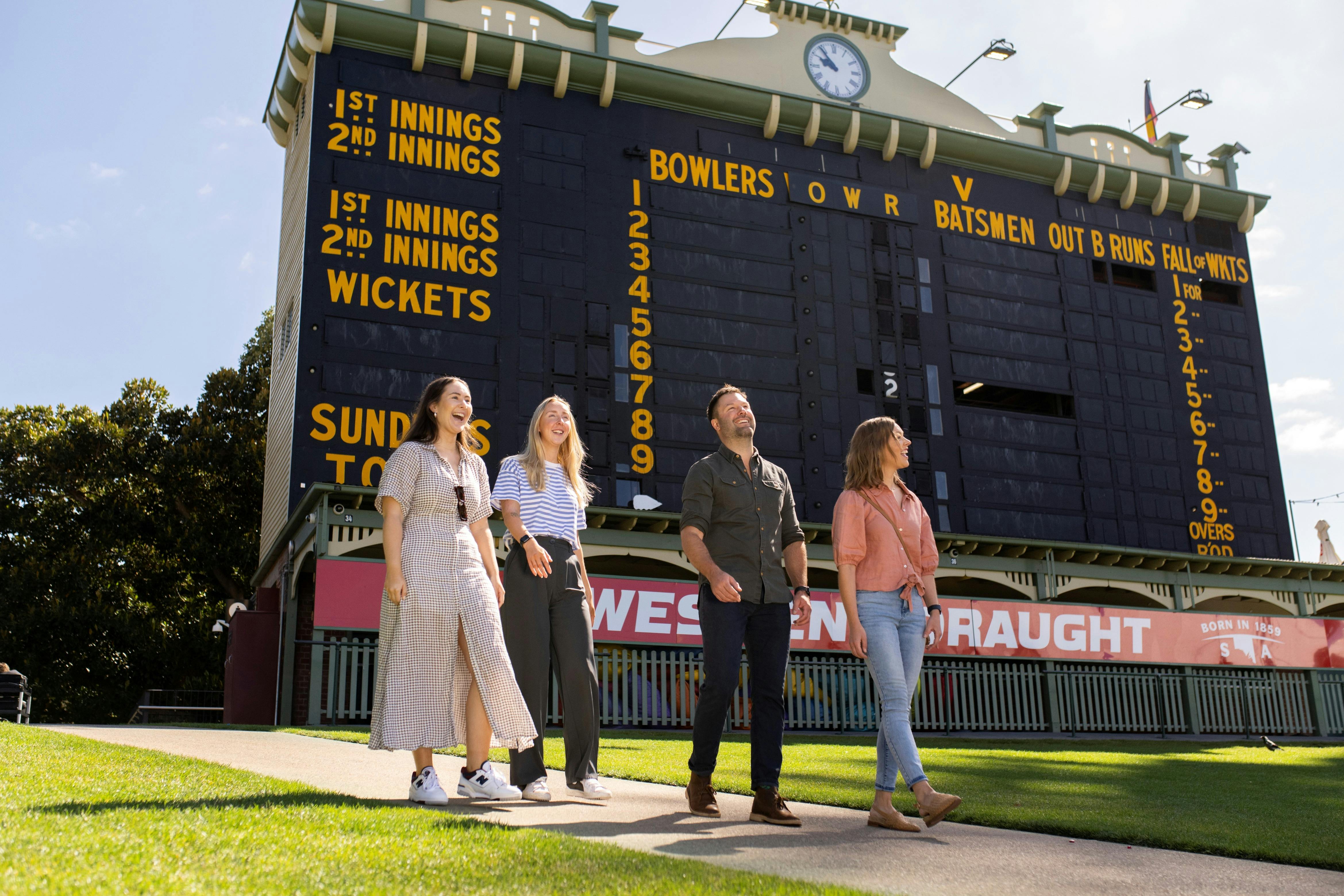 Tour group viewing Adelaide Oval heritage scoreboard