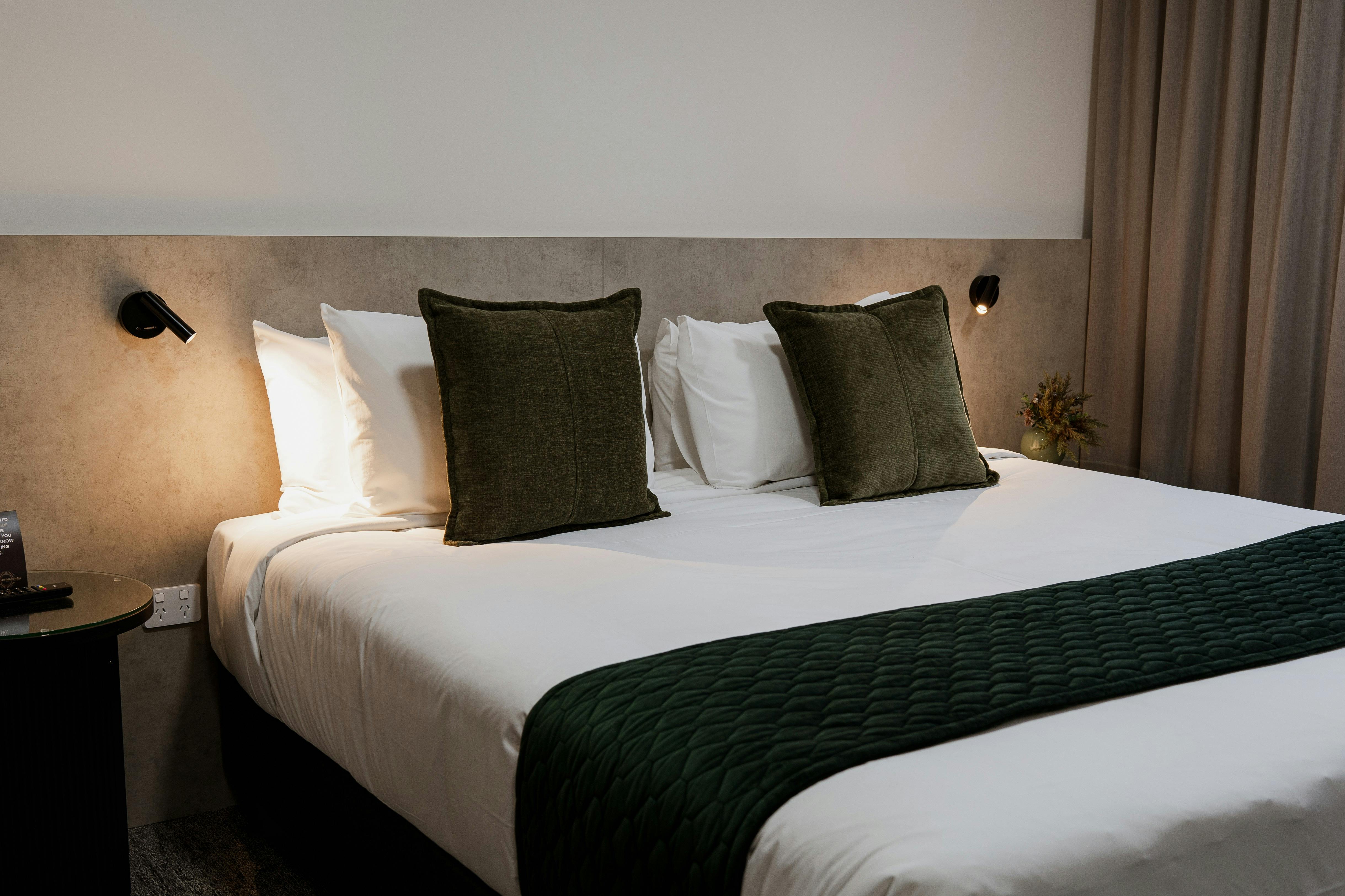 Elegantly designed Suites offering luxurious king bed with modern furnishings.