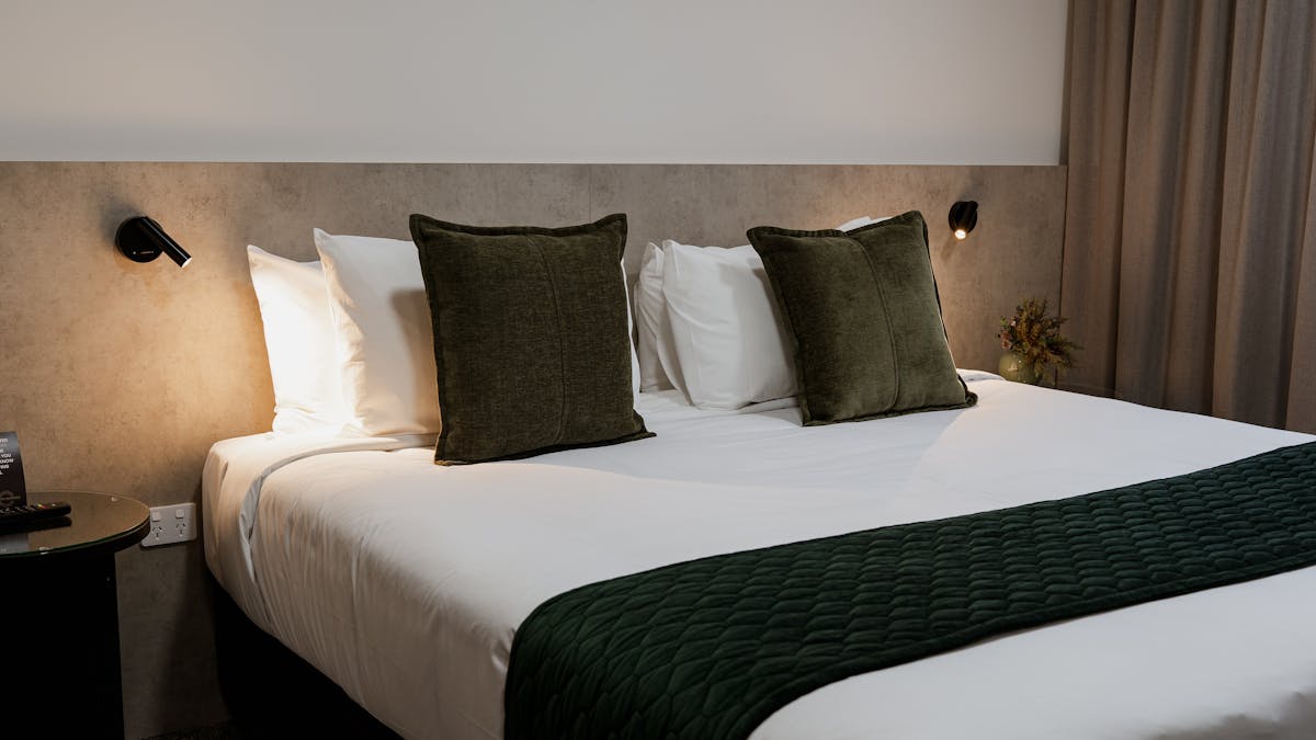 Elegantly designed Suites offering luxurious king bed with modern furnishings.