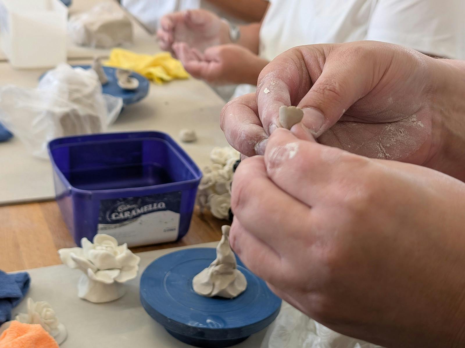 hands holding clay