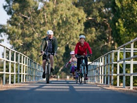 Myrtleford Cycle Centre owners, Steve and Claire with Emlyn, are also cyclists
