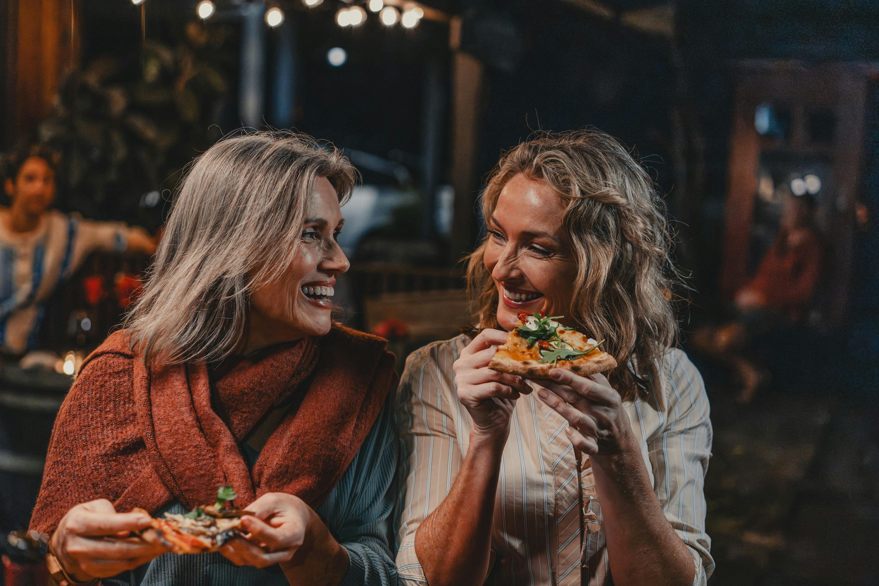 Couple enjoying pizza