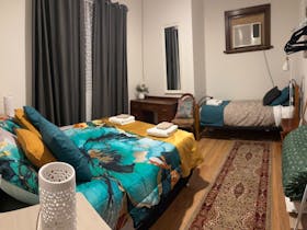 Spacious and inviting guest bedroom, one of five comfortable rooms for relaxing group stays.