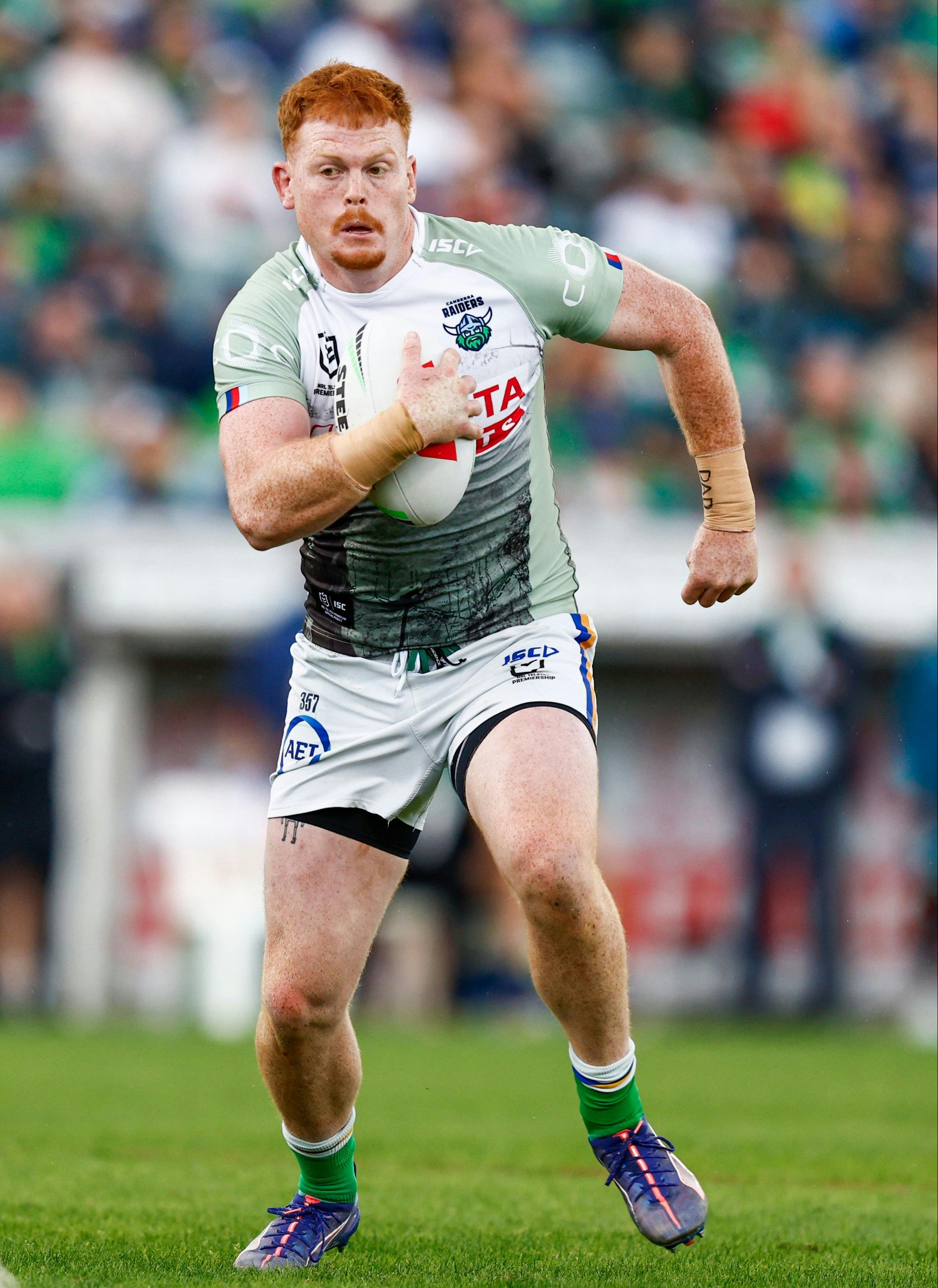 Canberra Raiders player Corey Horsburgh passing the ball.