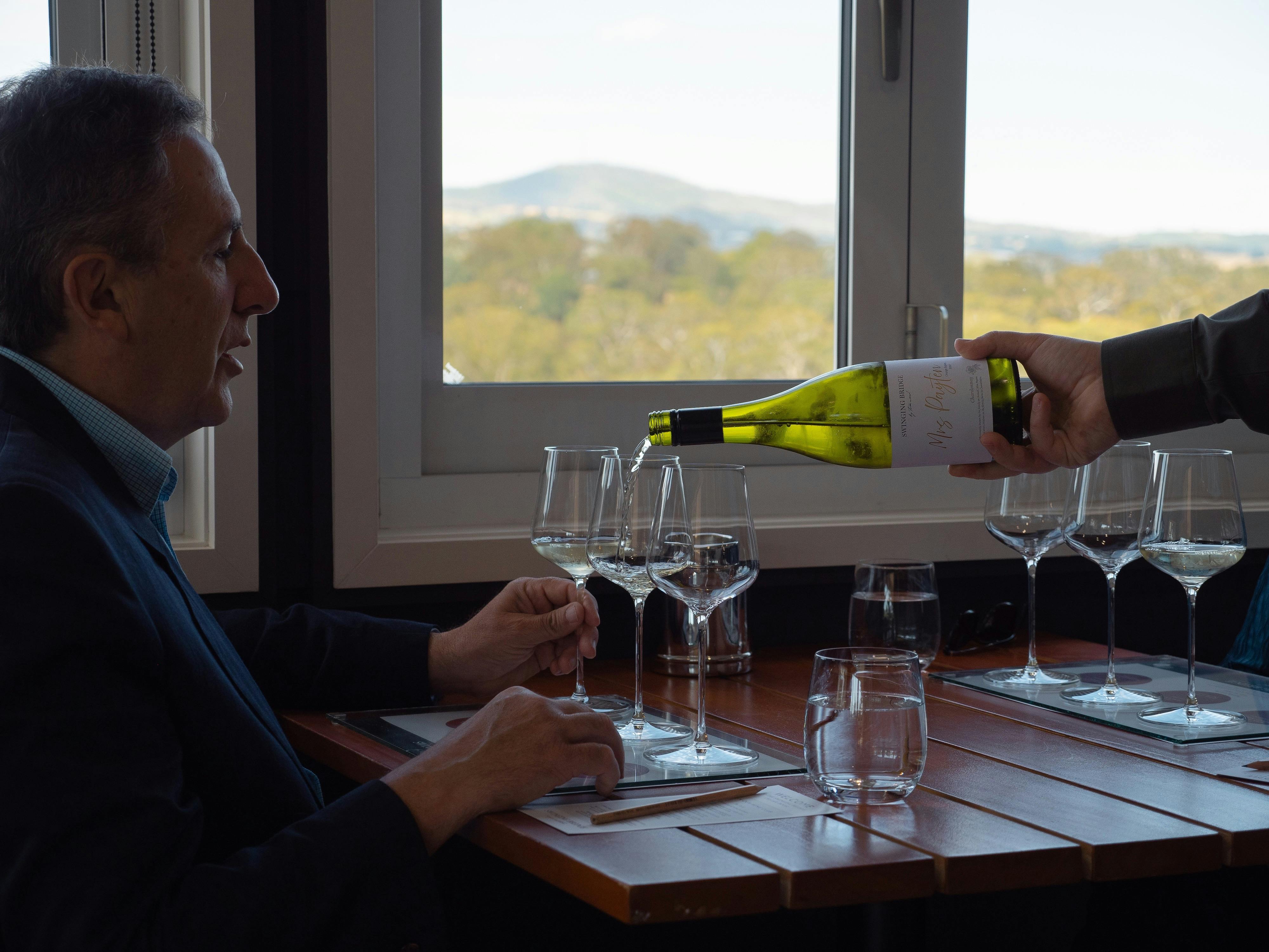 Wine being poured for a guest