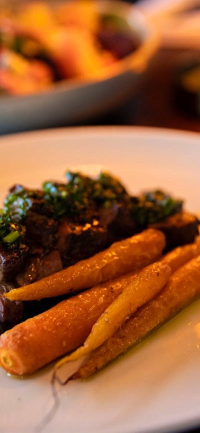 Lamb Rump Cap – Succulent lamb with glazed carrots, tomato salsa and chimichurri