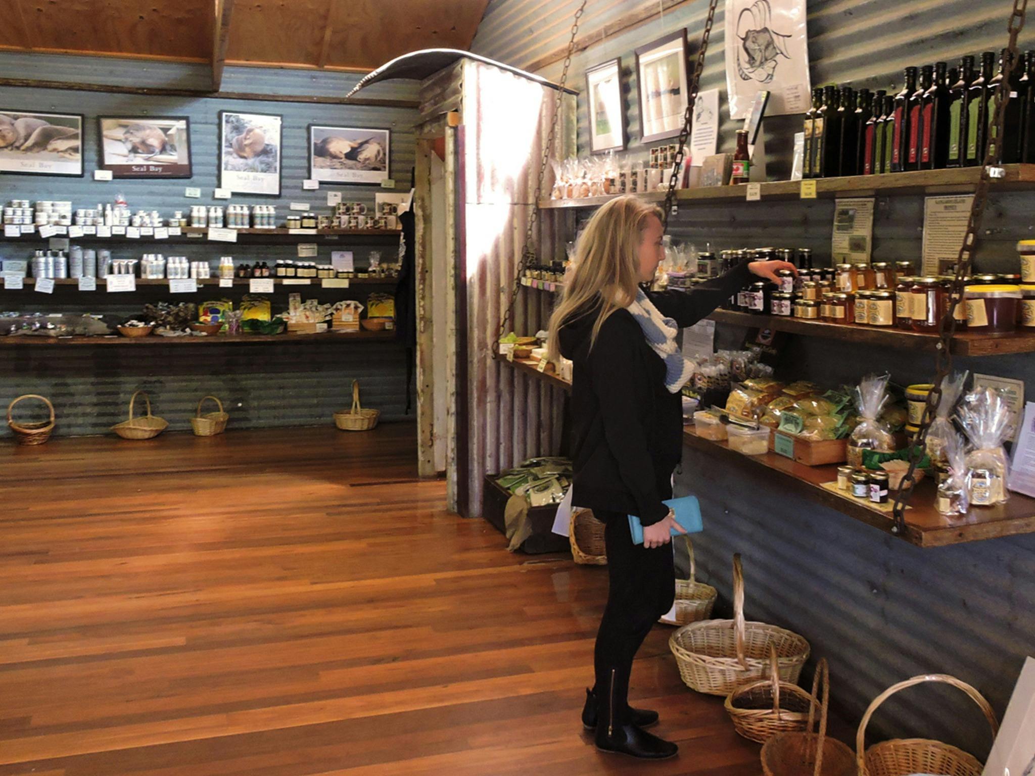 A woman browses the wares at Emu Ridge Eucalyptus Oil Distillery