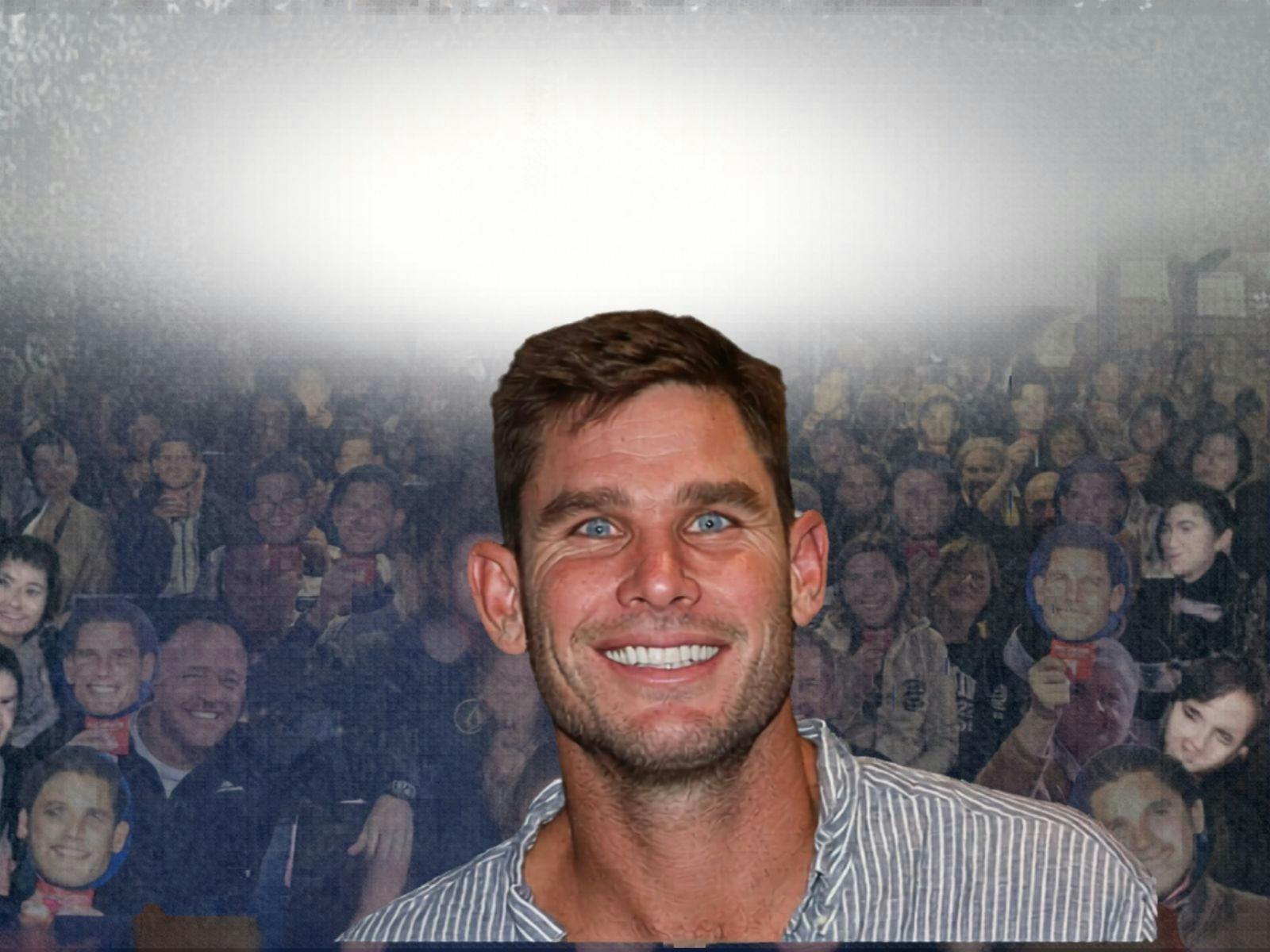 Tom Hawkins in front of a crowd of people