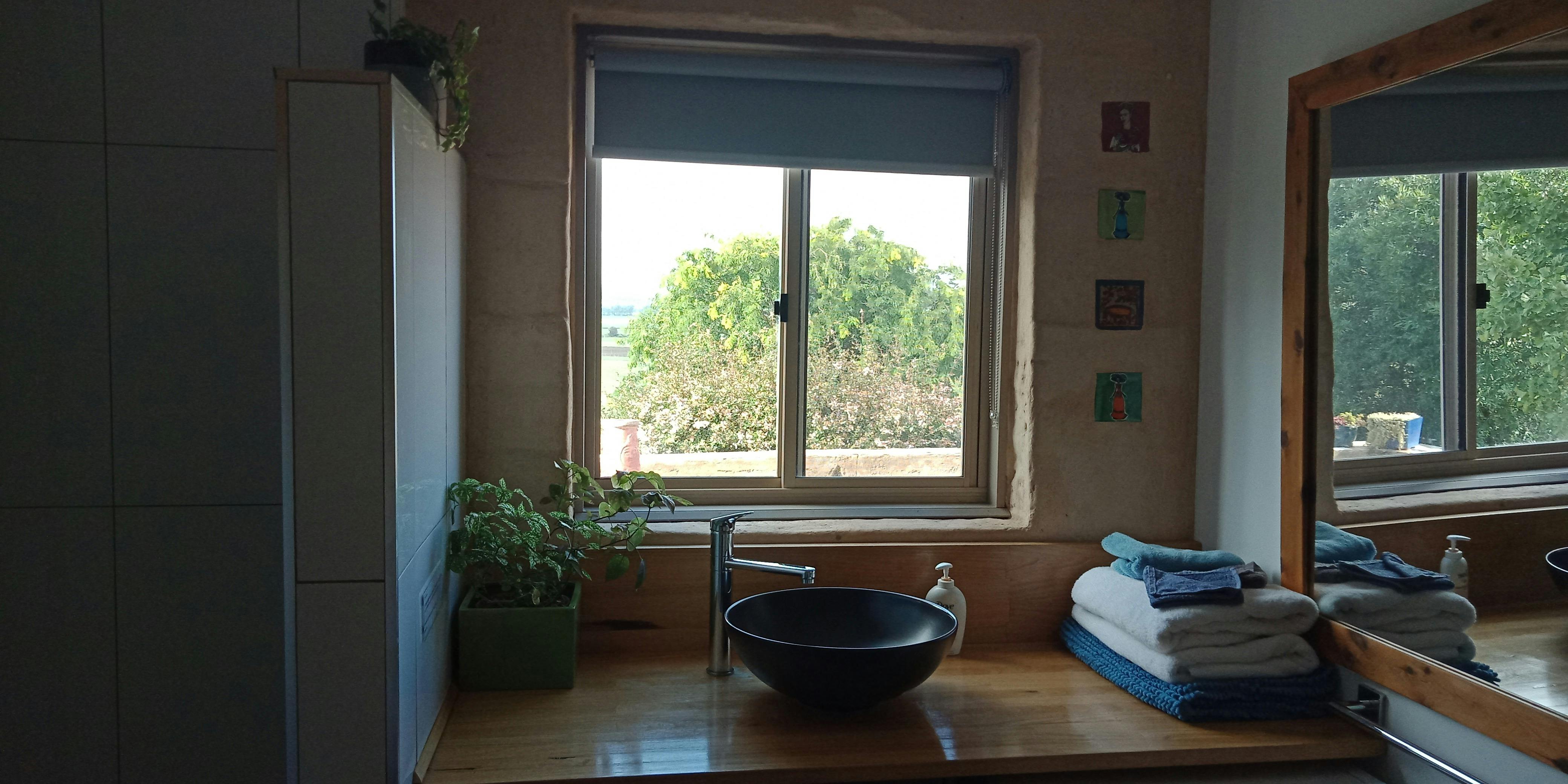 Bathroom. Washing machine is under the bench.