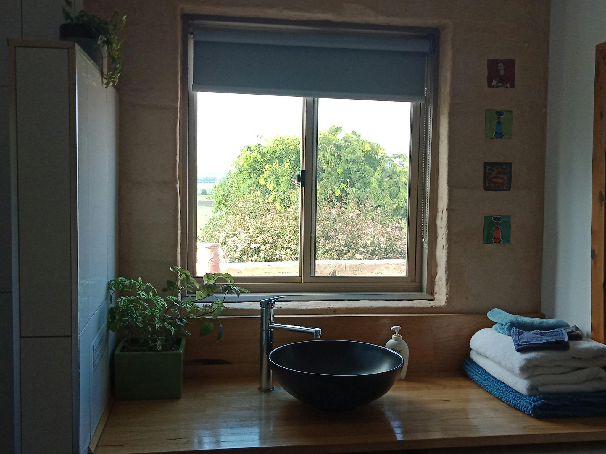 Bathroom. Washing machine is under the bench.