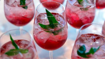 Pink cocktails with mint leave as decoration.