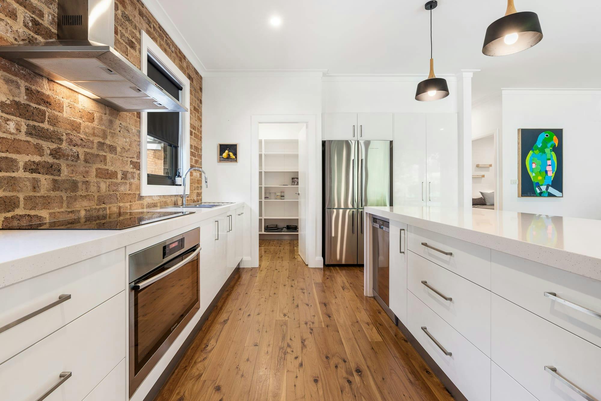 Kitchen with island bench and pantry