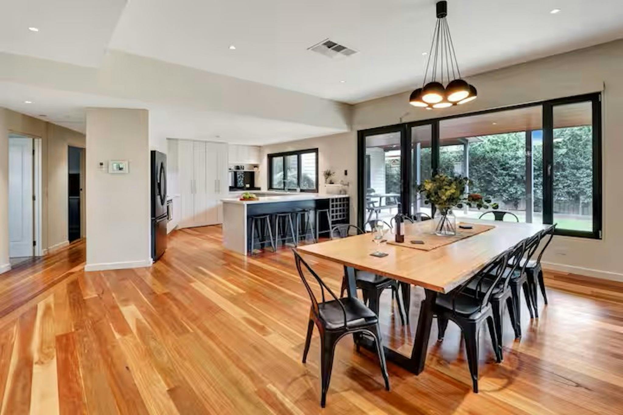 Open plan kitchen and dining area at Banksia House holiday accommodation Mansfield