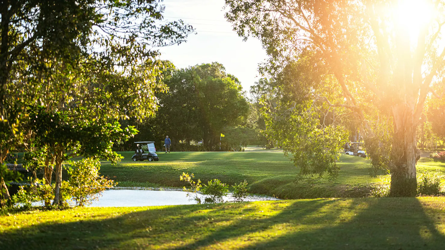 Sun setting over the course