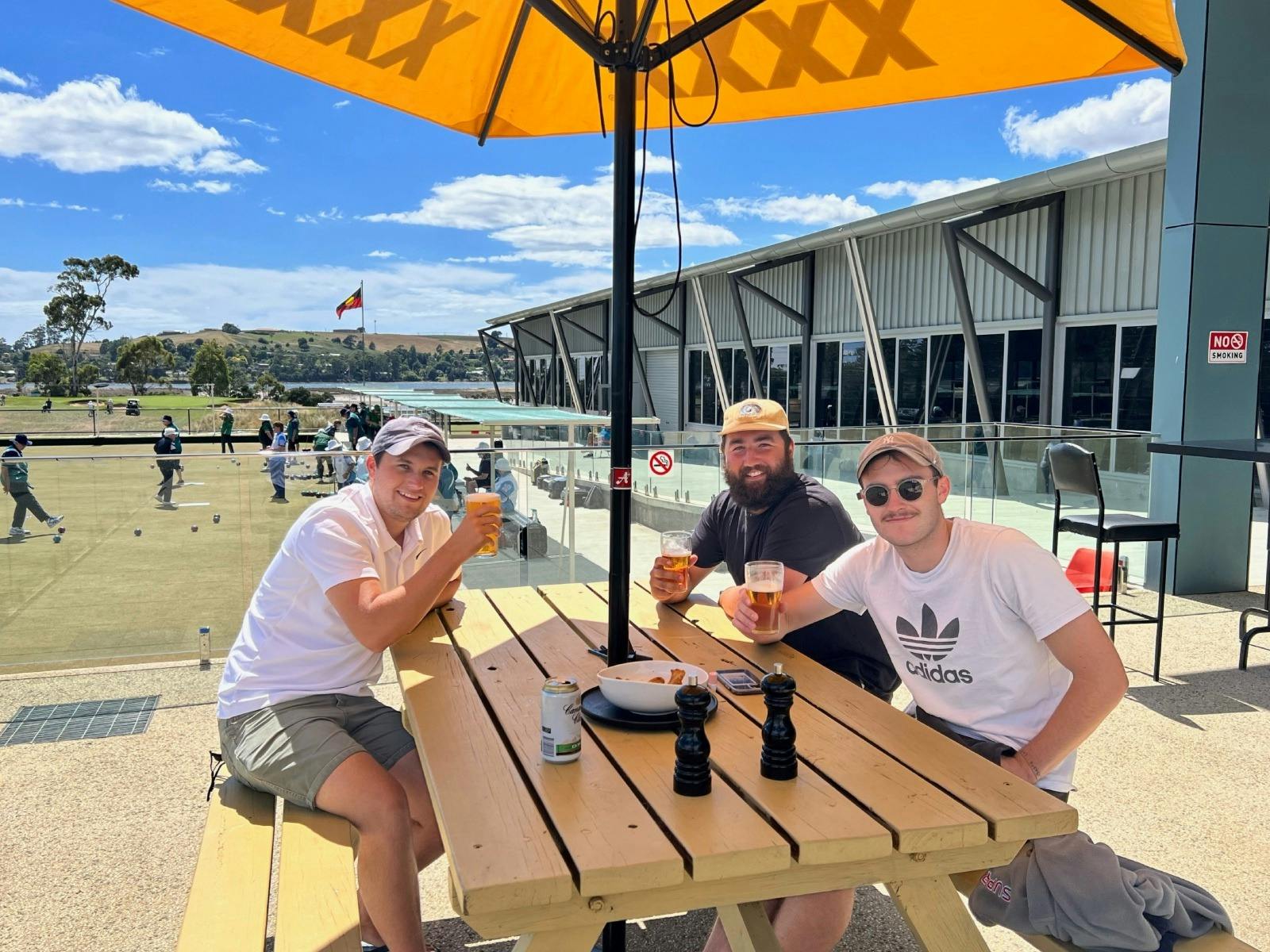 Members of the club enjoying a drink outside