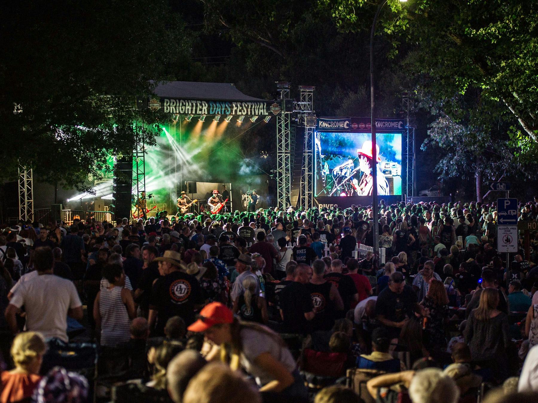 wide shot of the stage and crowd at night