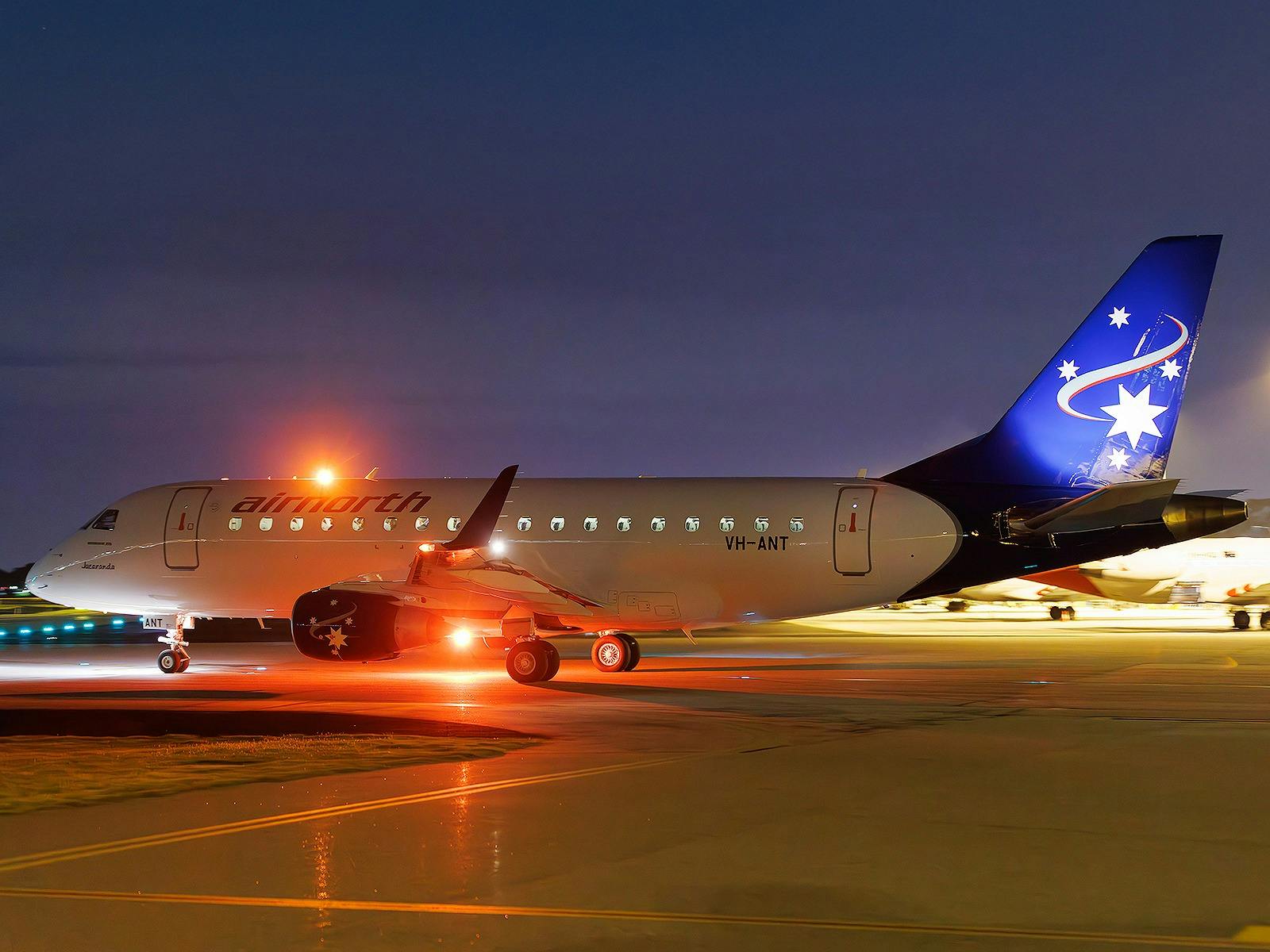 Embraer E170 at night