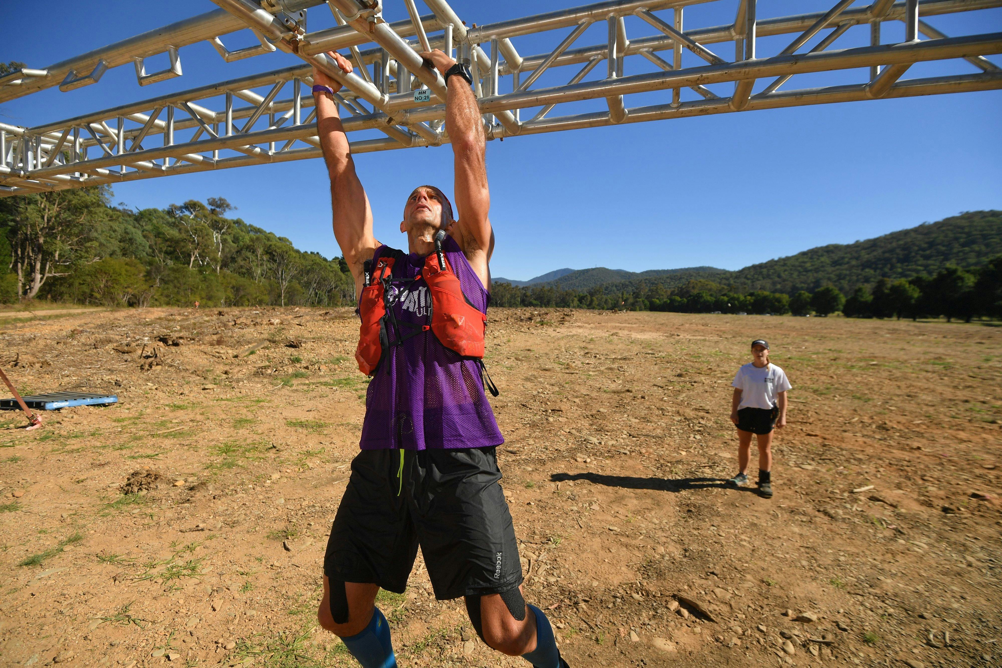 A person competes in Spartan Race.