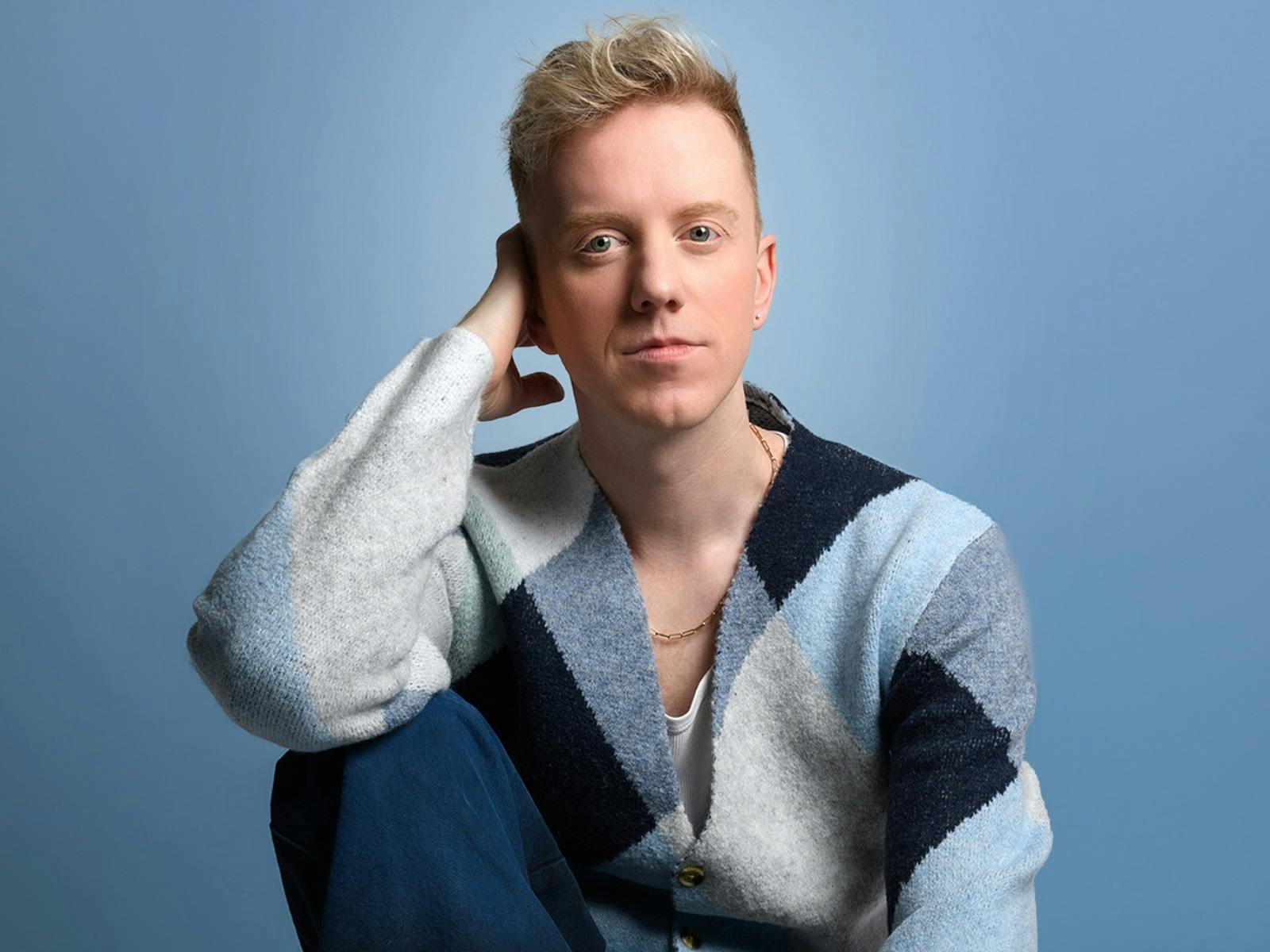 James Barr sat in a blue cardigan