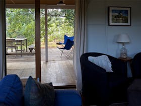 Loooking through the double doors from the couch to the north facing deck