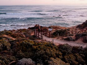 Customers viewing the ocean from lookout in Caunuda National Parkt