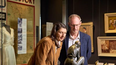 An older couple looking at a statue in the galleries of the Australian War Memorial