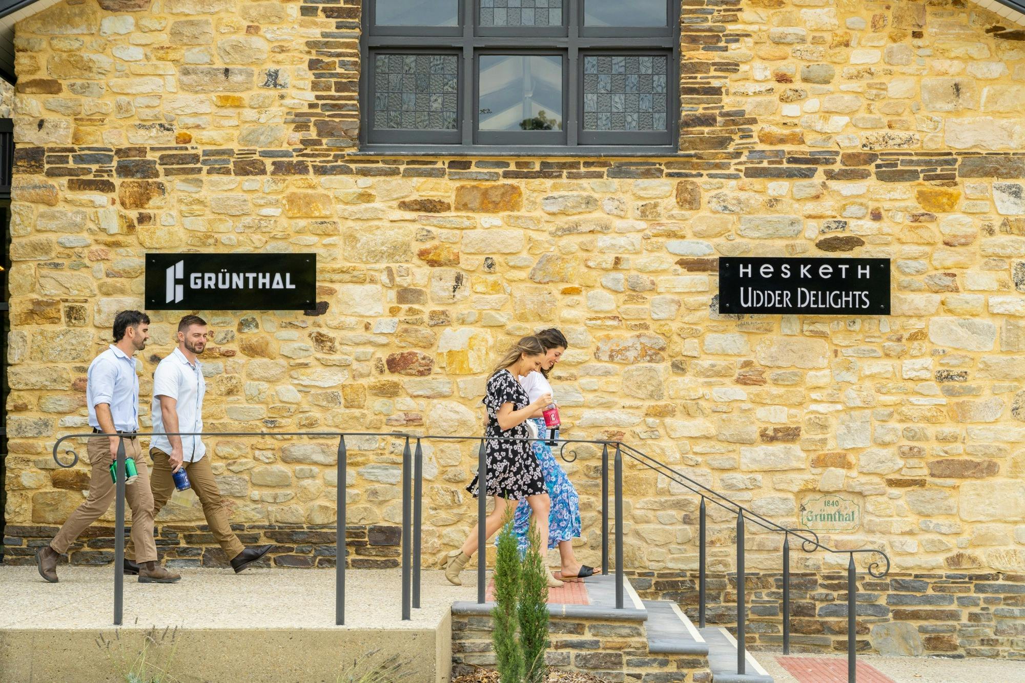 Customers leaving Grunthal Brew stone building