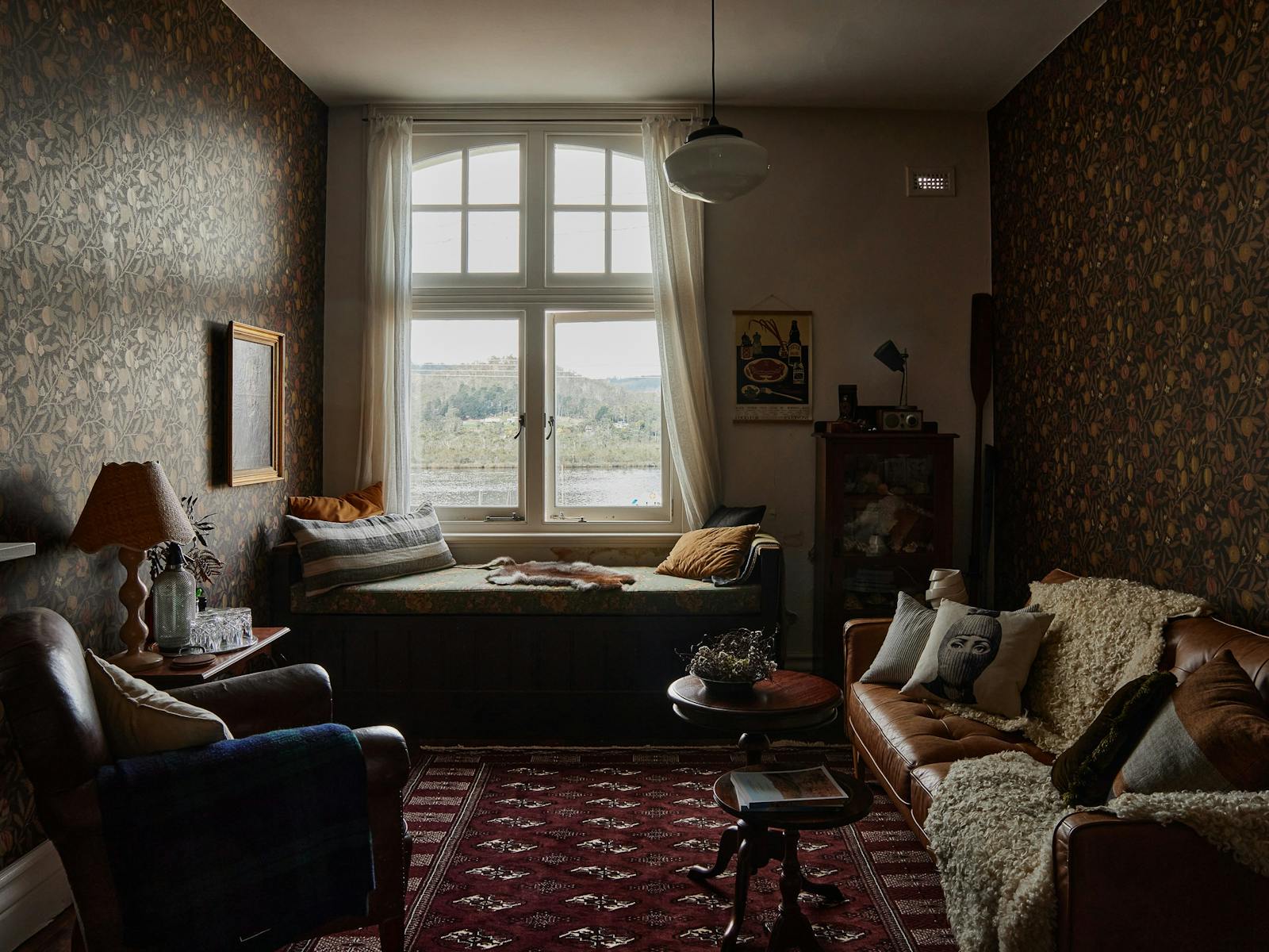 Moody sitting room with a river view