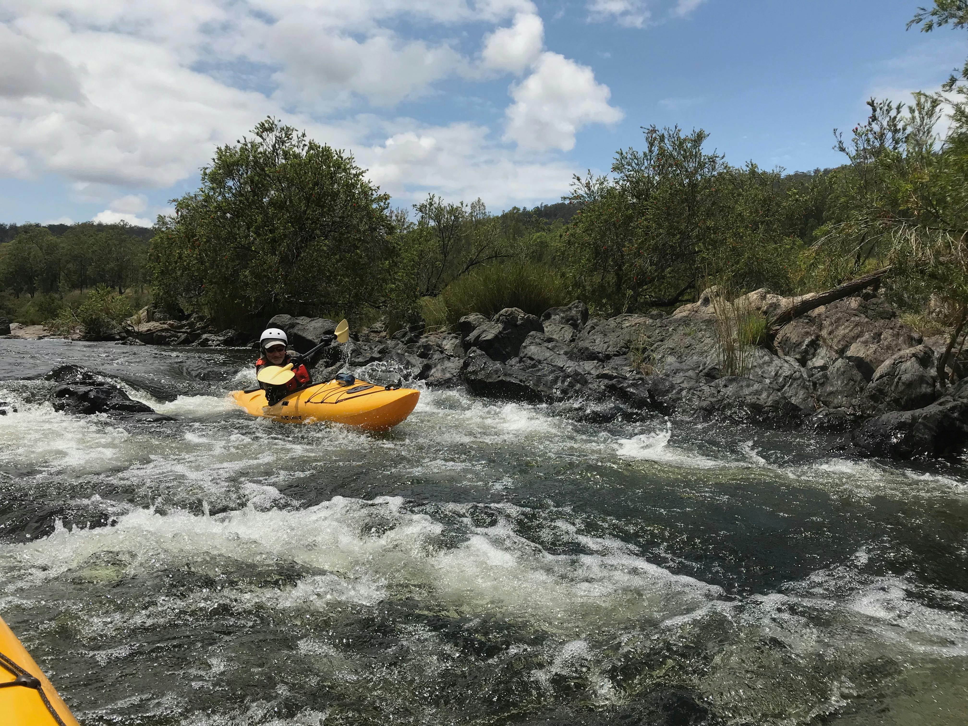 A kayaker is negotiating a rapid on the Nymboida river.