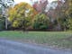 Gravel track and grassy area with a picnic table