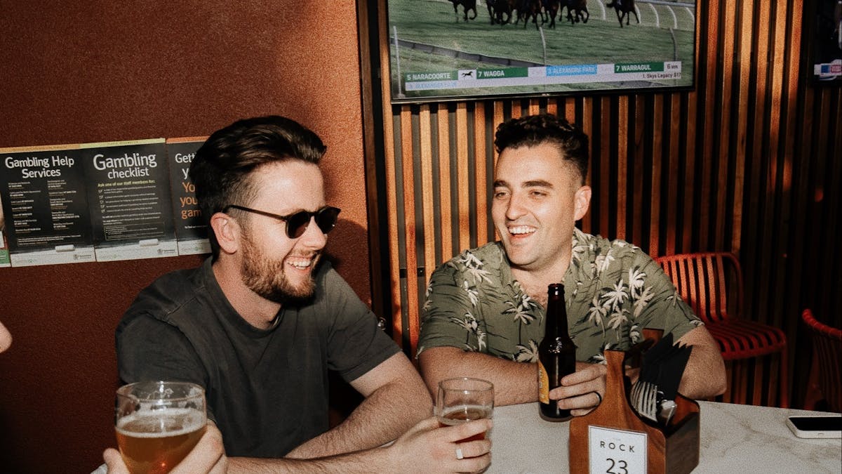 Two men sitting and chatting